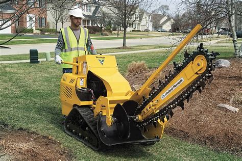 digging a trench with a mini excavator|small walk behind trench digger.